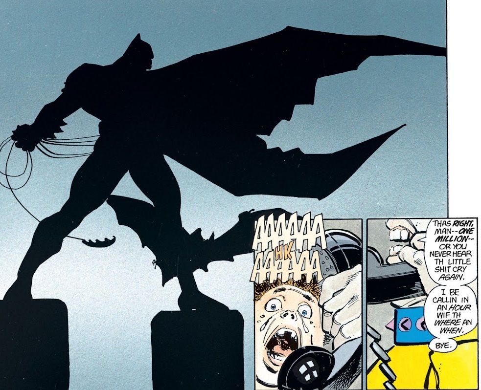 Batman rzucający haczykami na kije